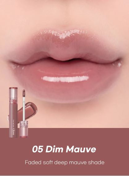 Romand Glasting Color Gloss - lūpu spīdums ar mitrinošu efektu un intensīva spīduma (glazētu) finišu. Pieklusināts brūngani violets tonis.